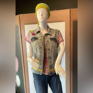 Retro upcycled denim jacket with hand embroidery and painting.